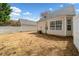 A fenced in backyard next to the house and detached garage at 2365 Parkside Club Ln, Lawrenceville, GA 30044