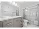 Stylish bathroom with a marble vanity, and a glass enclosed shower at 2365 Parkside Club Ln, Lawrenceville, GA 30044