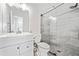 Updated bathroom with a modern vanity, toilet, and tiled glass shower at 2365 Parkside Club Ln, Lawrenceville, GA 30044