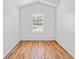 Well-lit bedroom features a large window and hardwood floors at 2365 Parkside Club Ln, Lawrenceville, GA 30044