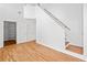 Entryway featuring hardwood floors, a staircase, and closet space providing a welcoming entrance at 2365 Parkside Club Ln, Lawrenceville, GA 30044