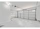 Spacious garage with shelving and a modern door at 2365 Parkside Club Ln, Lawrenceville, GA 30044