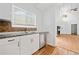 Modern kitchen with granite countertops, stainless steel appliances, and hardwood flooring flowing into the living area at 2365 Parkside Club Ln, Lawrenceville, GA 30044