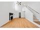 Open concept living room with high ceilings, fireplace, and hardwood floors at 2365 Parkside Club Ln, Lawrenceville, GA 30044