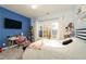 Bedroom with vibrant blue walls, a window, and a desk with a pink chair at 25 Cherokee Hills Dr, Rydal, GA 30171