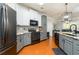 Kitchen features a breakfast bar, modern appliances, and stylish tiling at 25 Cherokee Hills Dr, Rydal, GA 30171