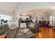 View of the open-concept living room and kitchen, complete with a large leather sofa at 25 Cherokee Hills Dr, Rydal, GA 30171
