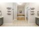 Bright bathroom with double vanities, soaking tub, and a separate shower at 25 Cherokee Hills Dr, Rydal, GA 30171