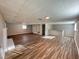 Spacious basement featuring wood floors, fireplace, and bar at 3633 Mill Glen Dr, Douglasville, GA 30135