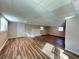 Spacious basement with vinyl floors, a fireplace, and natural light from multiple windows at 3633 Mill Glen Dr, Douglasville, GA 30135