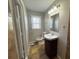 Bathroom featuring a granite vanity, a toilet, and a window at 3633 Mill Glen Dr, Douglasville, GA 30135