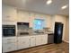 Kitchen featuring stainless steel appliances, granite countertops, and white cabinetry at 3633 Mill Glen Dr, Douglasville, GA 30135