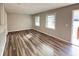 Living room featuring wood floors, natural light, and neutral paint at 3633 Mill Glen Dr, Douglasville, GA 30135