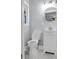 Well-lit bathroom with marble floors, an updated vanity, and a modern toilet at 2000 Fairburn Sw Rd, Atlanta, GA 30331