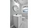 Bathroom featuring tiled floors, a new vanity, updated fixtures, and a large mirror and window at 2000 Fairburn Sw Rd, Atlanta, GA 30331