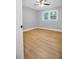 Inviting bedroom featuring wood floors, a ceiling fan, and a double-paned window for ample natural light at 2000 Fairburn Sw Rd, Atlanta, GA 30331