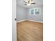 Bright bedroom with light wood floors and a ceiling fan, offering a cozy atmosphere at 2000 Fairburn Sw Rd, Atlanta, GA 30331