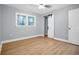 Bedroom featuring wood floors, a ceiling fan, and bright light from the double window at 2000 Fairburn Sw Rd, Atlanta, GA 30331