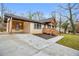 Inviting single-story home featuring a covered porch and driveway at 2000 Fairburn Sw Rd, Atlanta, GA 30331