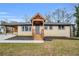 Charming single-story home featuring a front porch with wood columns and fresh landscaping at 2000 Fairburn Sw Rd, Atlanta, GA 30331