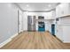 Bright kitchen features stainless steel appliances, white cabinets, and hardwood floors at 2000 Fairburn Sw Rd, Atlanta, GA 30331