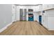 Bright kitchen features stainless steel appliances, white cabinets, and hardwood floors at 2000 Fairburn Sw Rd, Atlanta, GA 30331
