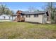 A view of the home featuring the deck area and a well-maintained backyard at 2000 Fairburn Sw Rd, Atlanta, GA 30331
