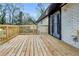 A new wooden deck with door access provides a great outdoor space for this home at 2000 Fairburn Sw Rd, Atlanta, GA 30331