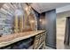 Custom bar area with a unique mural, wooden countertop, seating, and decorative lighting at 3071 Colonial Way # J, Atlanta, GA 30341