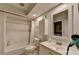 Bright bathroom featuring a shower-tub combo and vanity with essential toiletries at 3071 Colonial Way # J, Atlanta, GA 30341