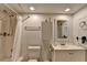 Bright bathroom featuring a shower-tub combo and vanity with essential toiletries at 3071 Colonial Way # J, Atlanta, GA 30341