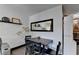 Dining area featuring a dark wood table and chairs, floating shelves, and modern decor at 3071 Colonial Way # J, Atlanta, GA 30341