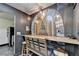 Unique dining and bar area with custom mural, stools, and decorative lighting fixtures at 3071 Colonial Way # J, Atlanta, GA 30341