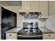 Bright kitchen featuring stainless steel appliances and granite countertops at 3071 Colonial Way # J, Atlanta, GA 30341