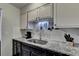 Kitchen area with granite countertops and white cabinets at 3071 Colonial Way # J, Atlanta, GA 30341