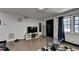 Open living area with hardwood floors, TV, and modern furnishings at 3071 Colonial Way # J, Atlanta, GA 30341