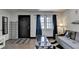 Living room with entry, window, sofa, and hardwood floors at 3071 Colonial Way # J, Atlanta, GA 30341