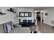 Living room view showcasing a gray couch, hardwood floors, and adjacent dining area at 3071 Colonial Way # J, Atlanta, GA 30341