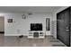 Neutral living room featuring hardwood floors, modern TV console, and minimalist decor at 3071 Colonial Way # J, Atlanta, GA 30341
