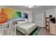 Primary bedroom with a colorful mural and a work space near the window at 3071 Colonial Way # J, Atlanta, GA 30341