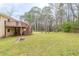 Picturesque backyard with a deck, mature trees and ample space for outdoor activities and landscaping at 3202 Betty Cir, Decatur, GA 30032