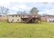 Spacious backyard featuring a deck and stairs, offering ample outdoor living and entertaining possibilities at 3202 Betty Cir, Decatur, GA 30032