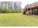 Well-manicured backyard with a two-story deck and stairs, providing outdoor enjoyment at 3202 Betty Cir, Decatur, GA 30032