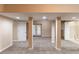 Finished basement area with carpet, and exterior door at 3202 Betty Cir, Decatur, GA 30032