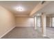 Finished basement with tan carpet and support beams at 3202 Betty Cir, Decatur, GA 30032
