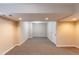 Finished basement area with neutral walls and carpet at 3202 Betty Cir, Decatur, GA 30032