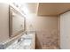 Bathroom featuring double sinks, granite countertops, and tiled walls at 3202 Betty Cir, Decatur, GA 30032
