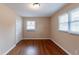 Bedroom featuring hardwood floors, windows, and closet at 3202 Betty Cir, Decatur, GA 30032
