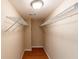 Walk-in closet with custom shelves and hardwood floors at 3202 Betty Cir, Decatur, GA 30032