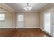 Dining room with hardwood floors, light fixture, and access to back entrance at 3202 Betty Cir, Decatur, GA 30032